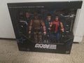 G.I. Joe action figure set in packaging on a carpeted floor.