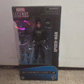 Marvel Legends Spider-Man action figure in packaging on a carpeted floor.